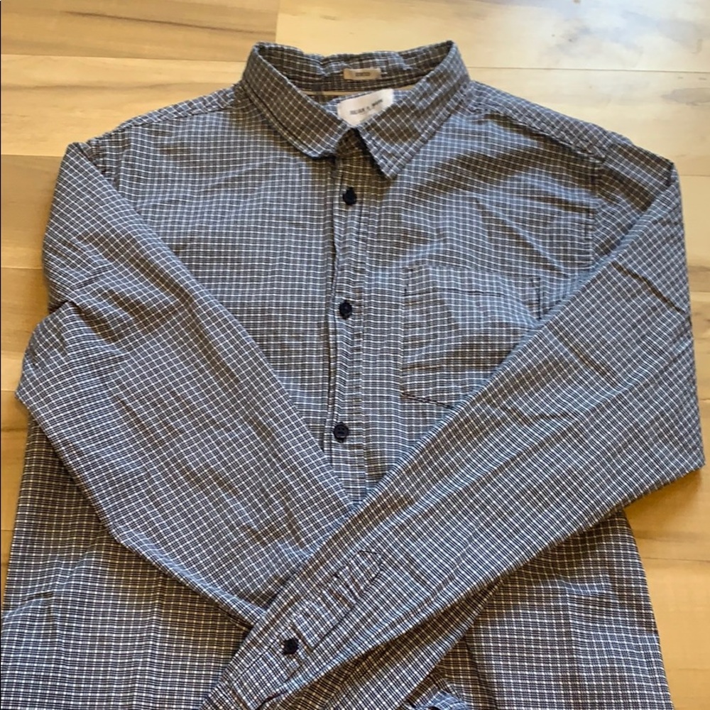 Men’s plaid, button down shirt.
